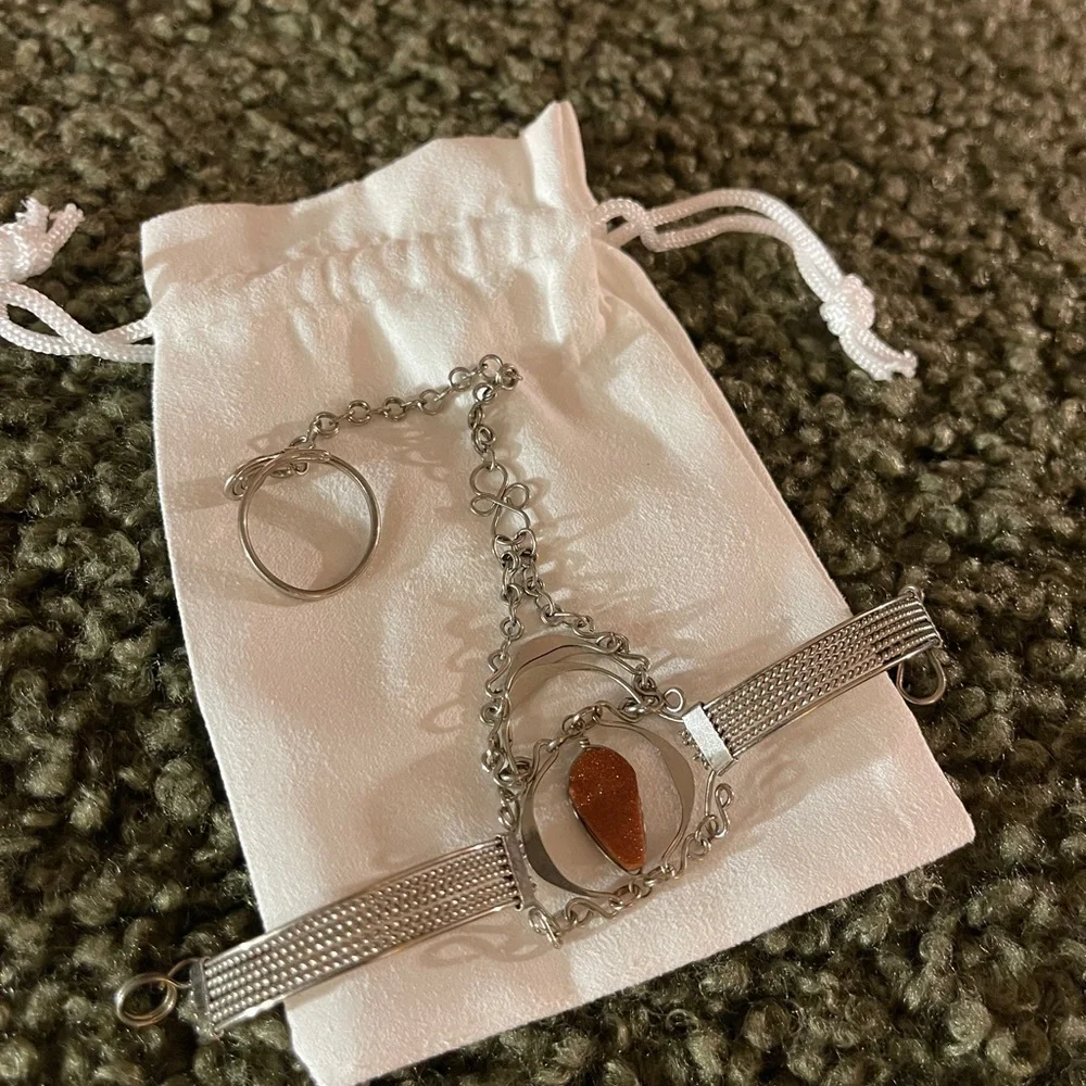 Goldstone and silver metal bracelet